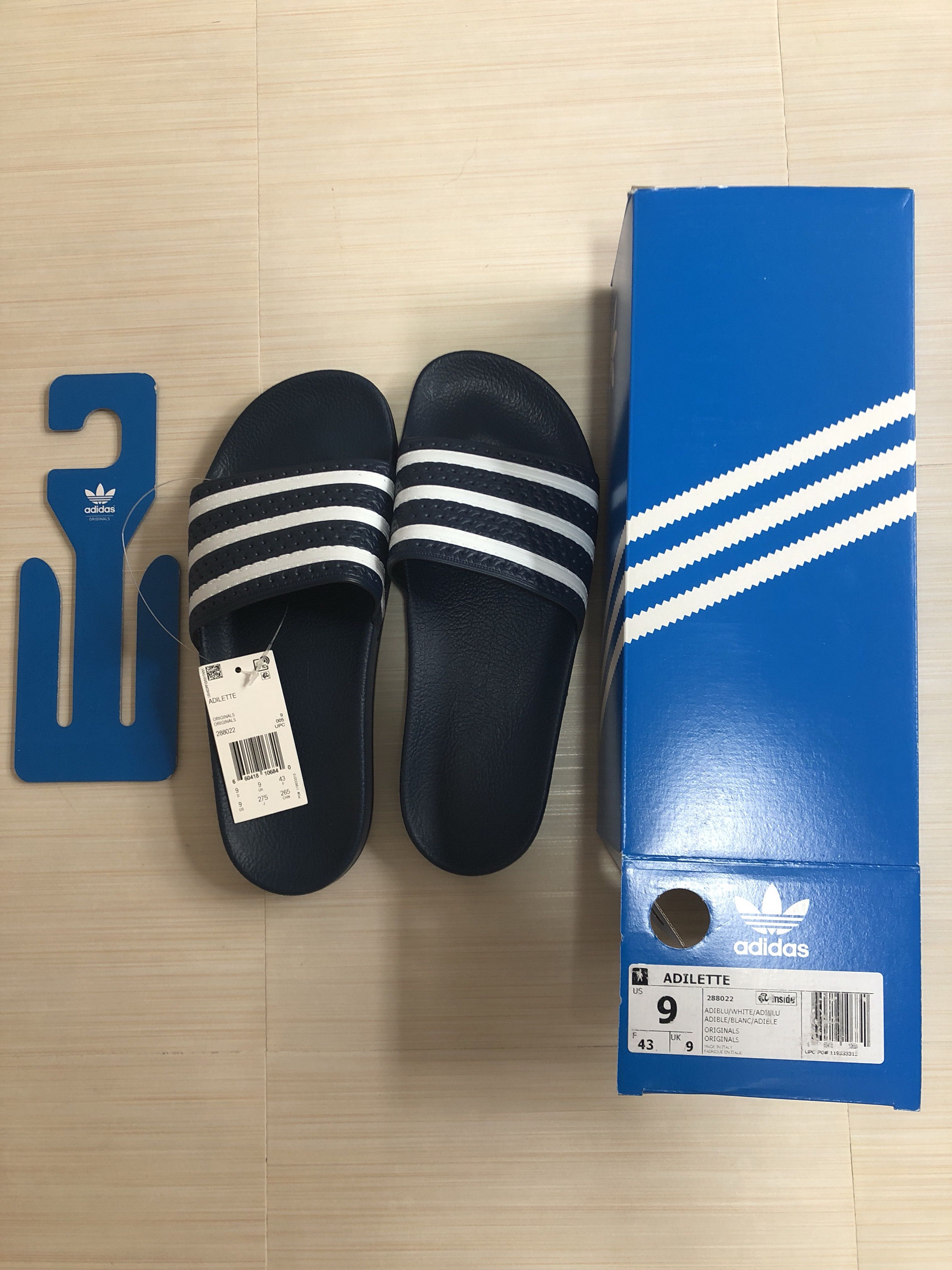 dark blue adidas slides