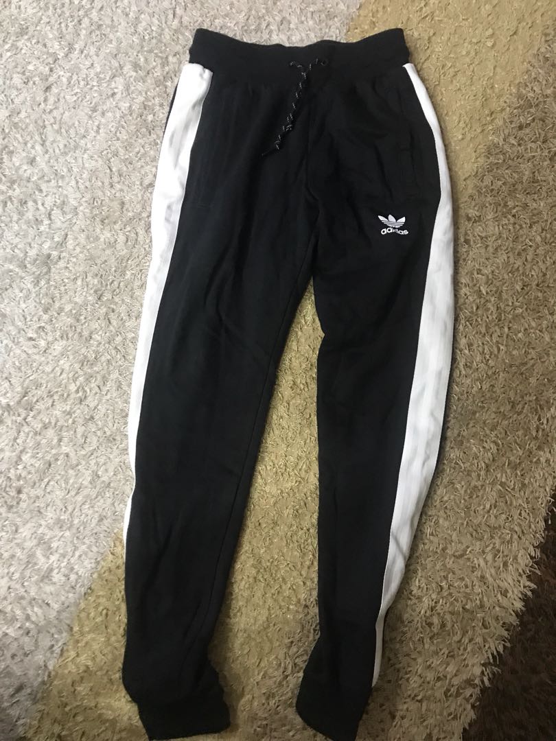 white and black adidas track pants