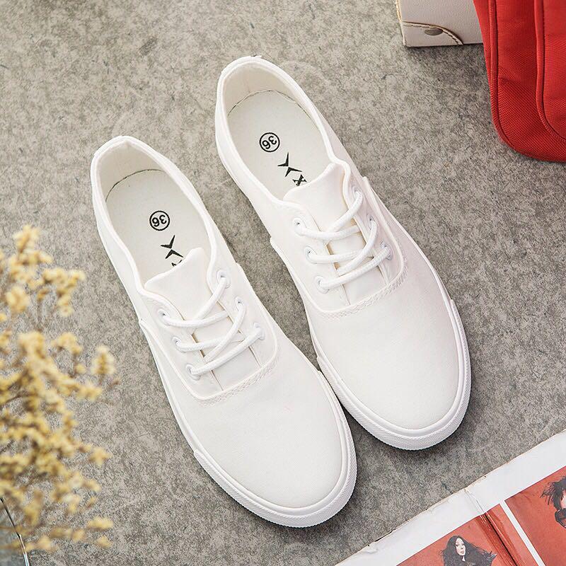 Plain white store canvas sneakers