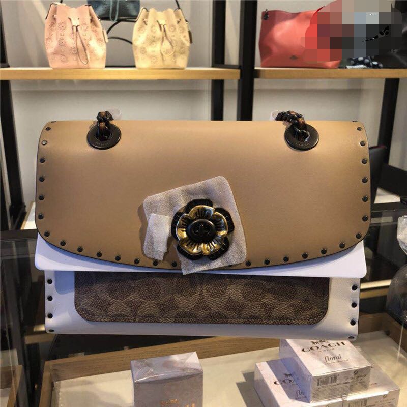 Parker in signature canvas with rivets and snakeskin detail top