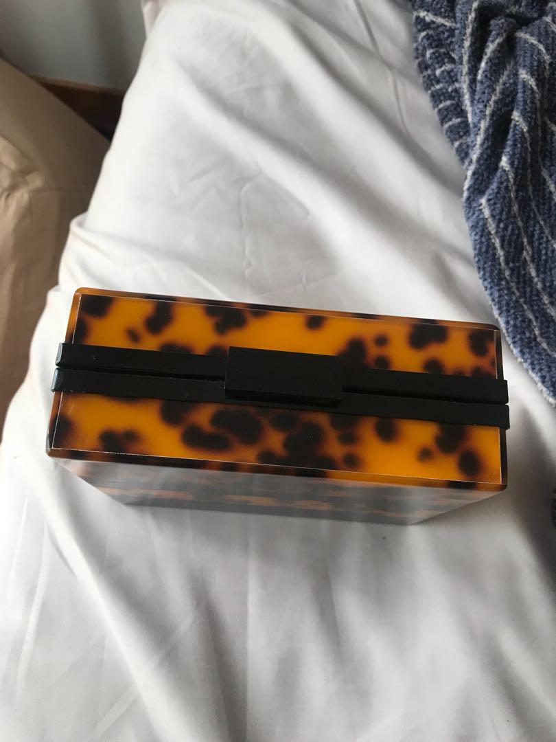 zara tortoiseshell clutch