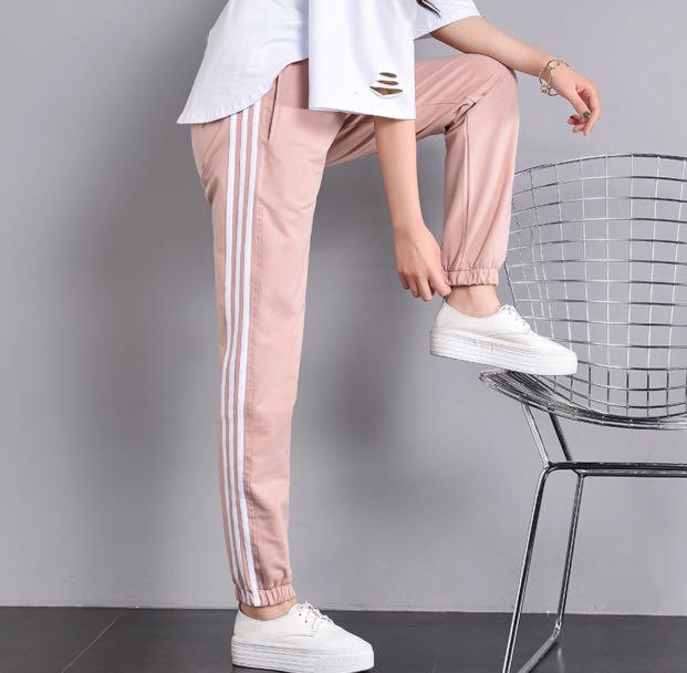 pink joggers with white stripe