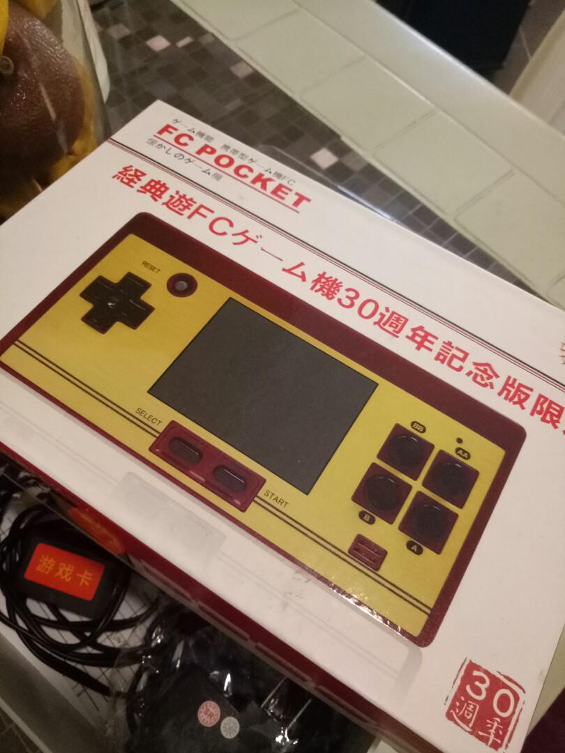 FC Pocket Game Console (Category: Others) located in Carmona. Submitted by genperf (Listing ID 185509943, Image 3). Description: Slightly used FC Compact Game Console, color maroon. Complete with controller, extra cartridge game, AV cord and case. Still in very good condition..