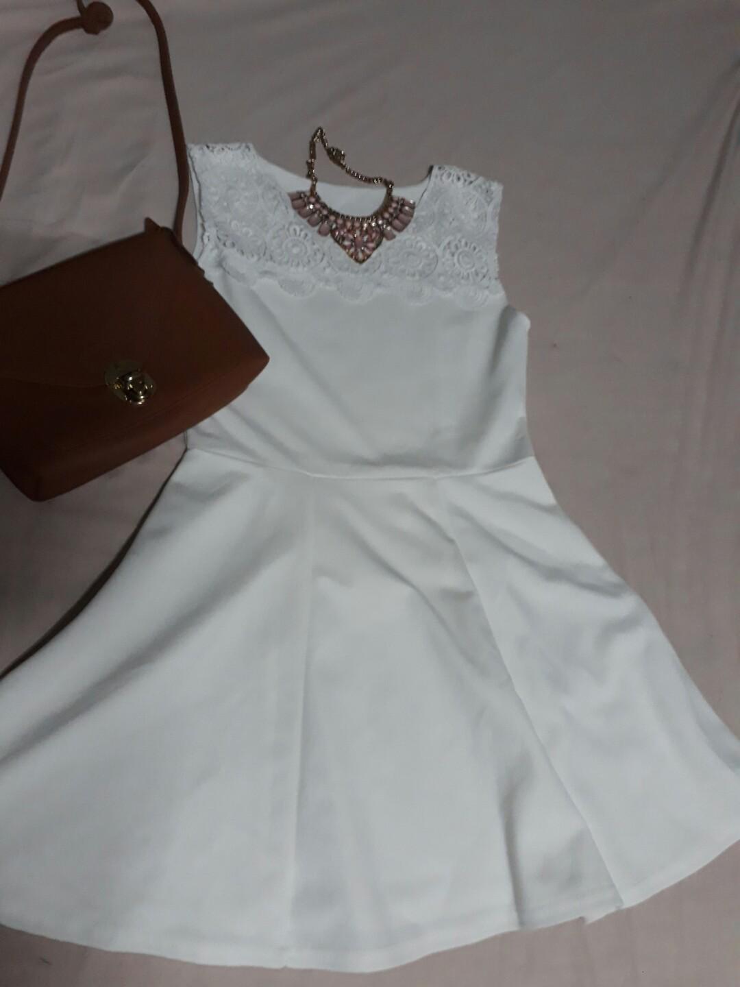 White dress with lace details (Category: Evening dresses & gowns) located in Taguig. Submitted by khaleexis (Listing ID 186200633, Image 2). Description: 🌟Used but not abused🌟 🌟Perfect for any occasion🌟 Accessories not included.