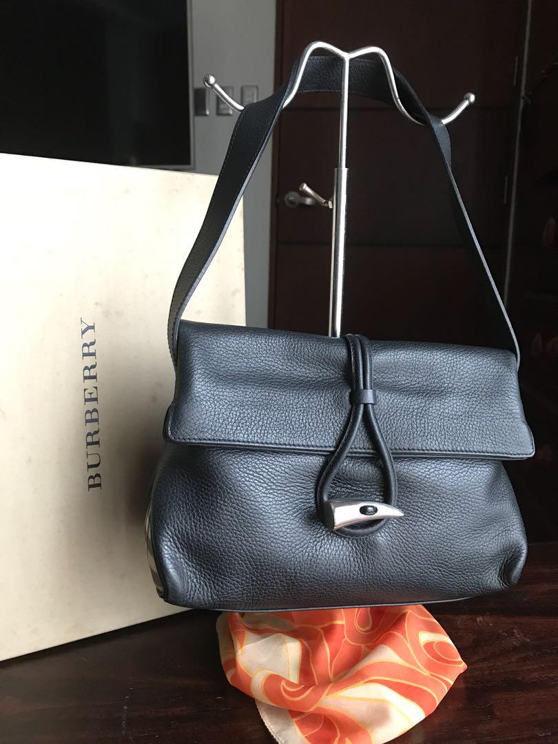Authentic Burberry (Category: Luxury Bags & Wallets) located in Quezon City. Submitted by kijurean (Listing ID 186413859, Image 1). Description: Authentic pre-loved Burberry bag Black calf grain leather Very clean in and out Minor creases, a natural leather response due to use Comes with box only .