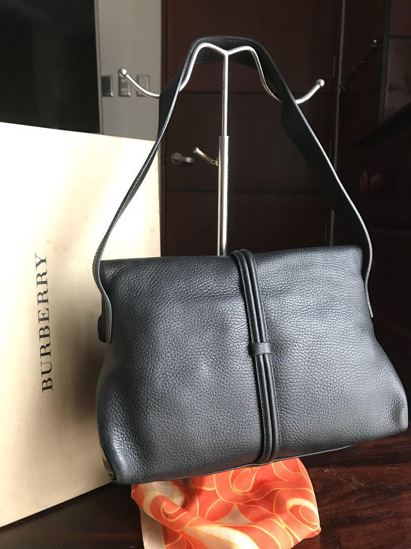 Authentic Burberry (Category: Luxury Bags & Wallets) located in Quezon City. Submitted by kijurean (Listing ID 186413859, Image 2). Description: Authentic pre-loved Burberry bag Black calf grain leather Very clean in and out Minor creases, a natural leather response due to use Comes with box only .