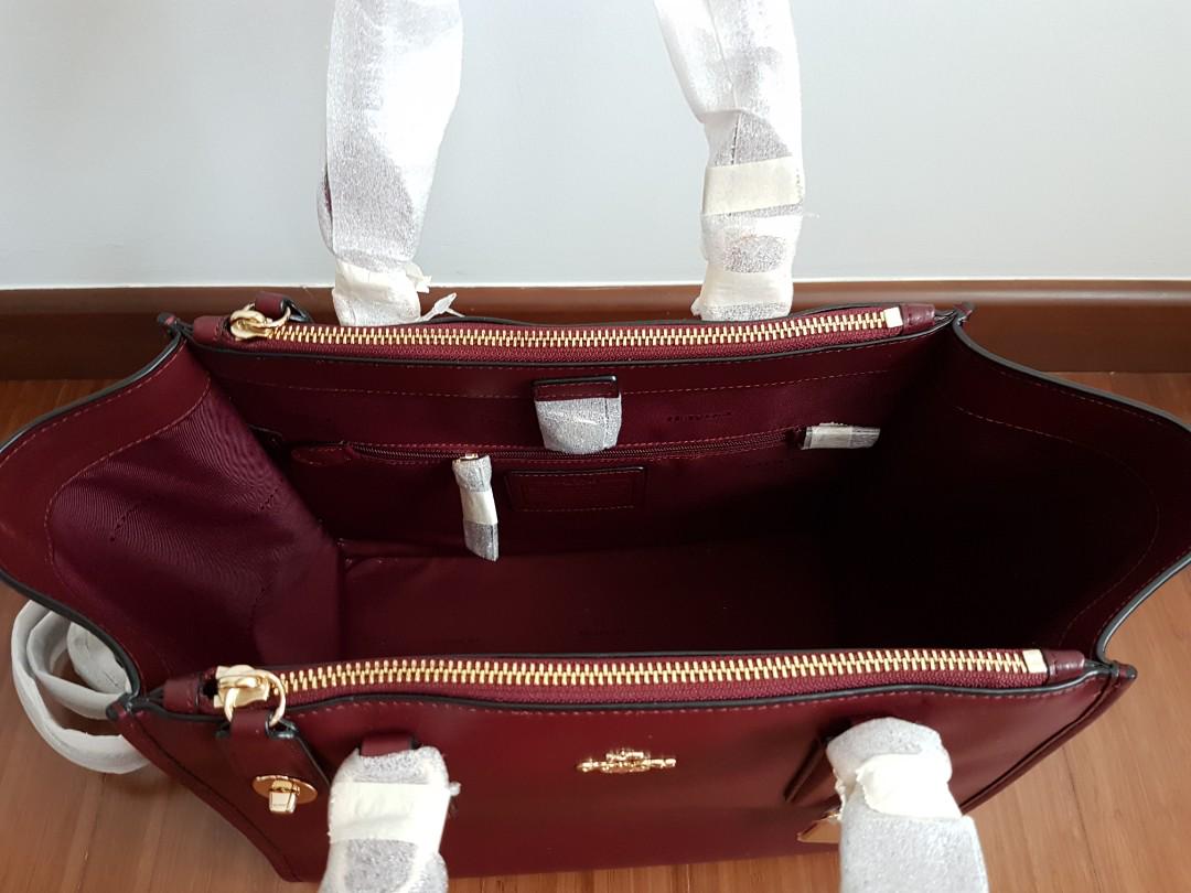 Maroon coach hotsell wristlet