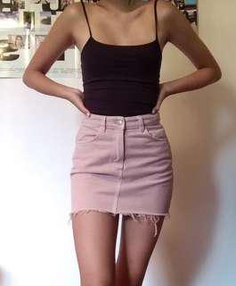 Pastel pink denim mini skirt