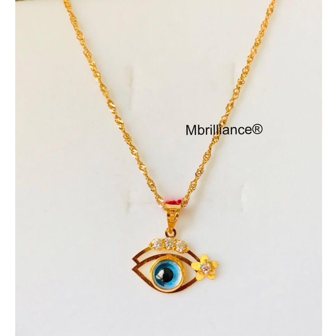 gold greek evil eye pendant