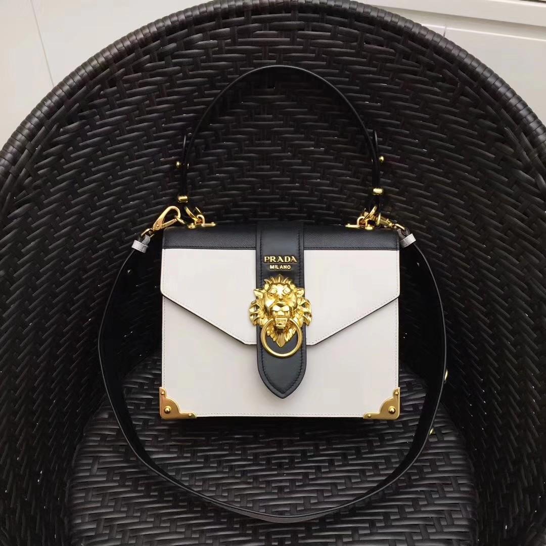 Prada cahier animalier lion head bag, Luxury, Bags & Wallets on Carousell