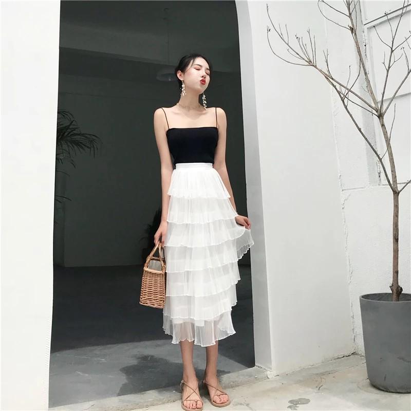 white skirt black top outfit