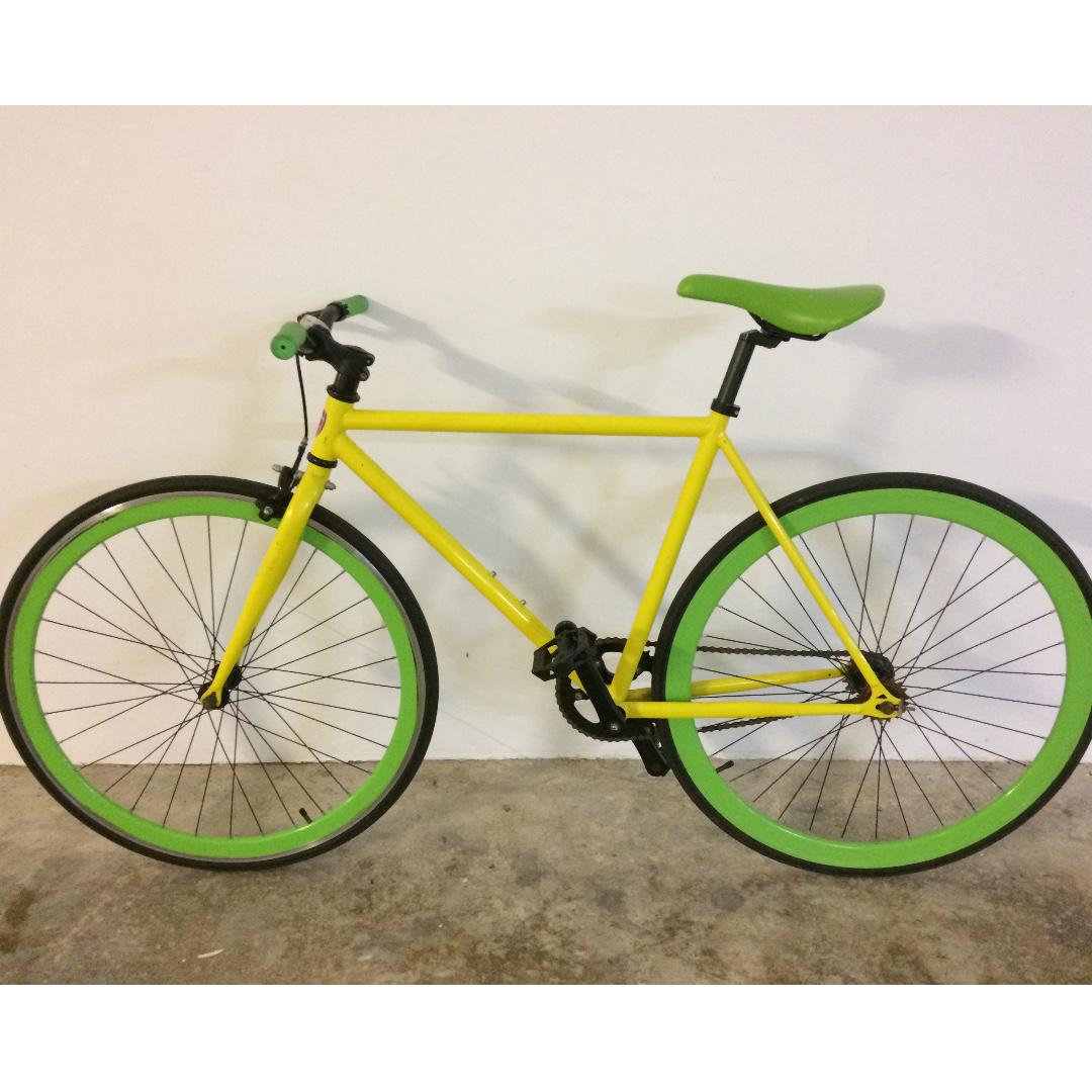 yellow fixed gear bike