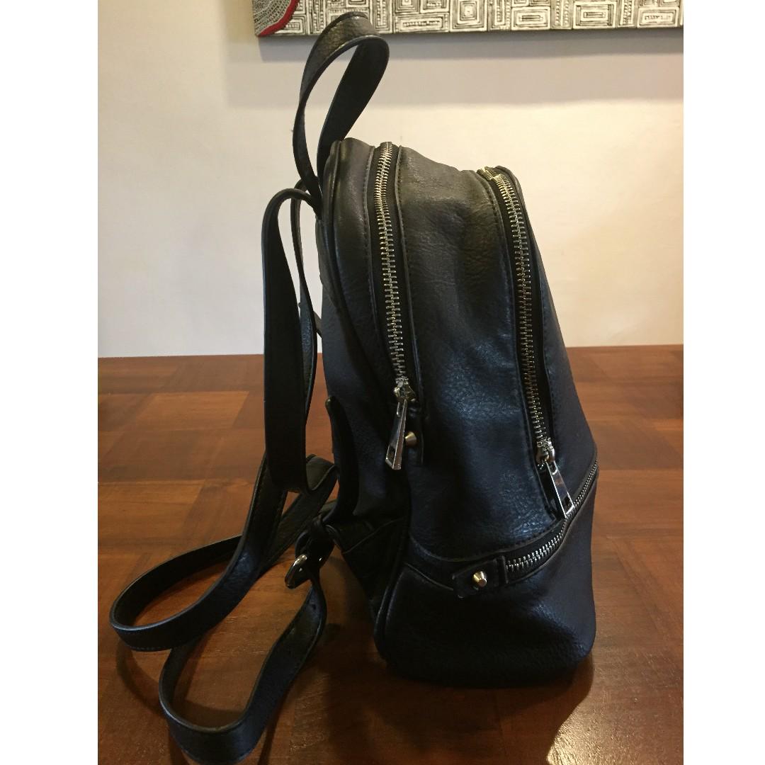 Almost NEW SPORTSGIRL Black faux Leather Backpack with zipped front pocket