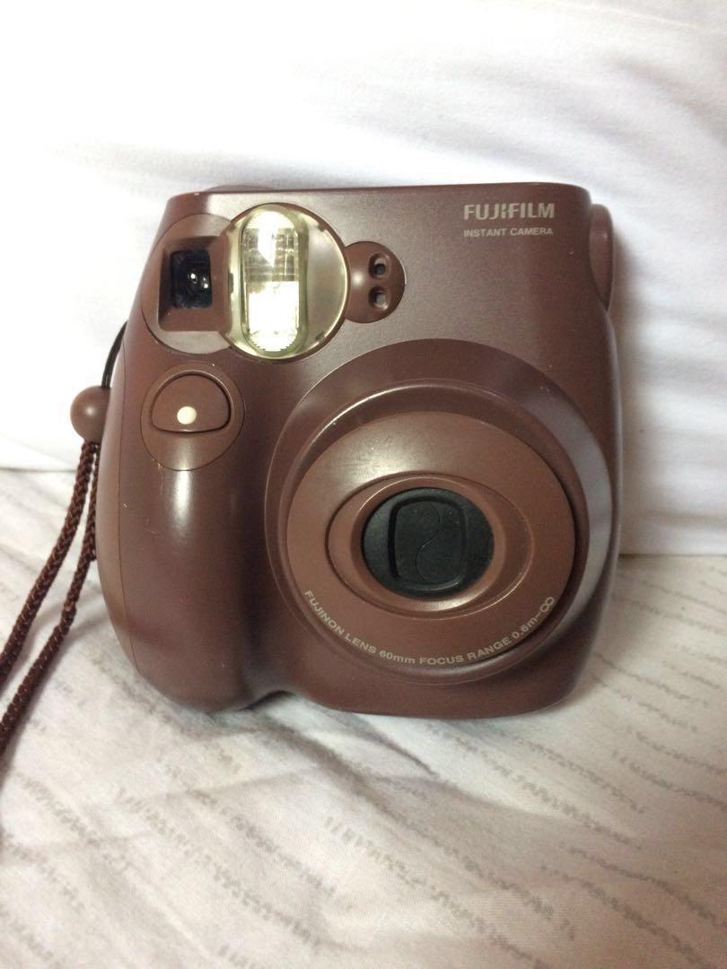 AUTHENTIC Fujifilm Instax Mini Instant Film Camera with Hand Strap (Category: Cameras) located in Manila. Submitted by ces.summers (Listing ID 189054401, Image 1). Description: AUTHENTIC IMPORTED FROM JAPAN Brand: Fujifilm Color: Chocolate Brown Condition: Preloved but Well Loved Features: Auto Focus AA Batteries to operate Easy and quick functions Adjustment dial to customize brightness *Batteries not included #caroufluff #TravelwithCarousell.