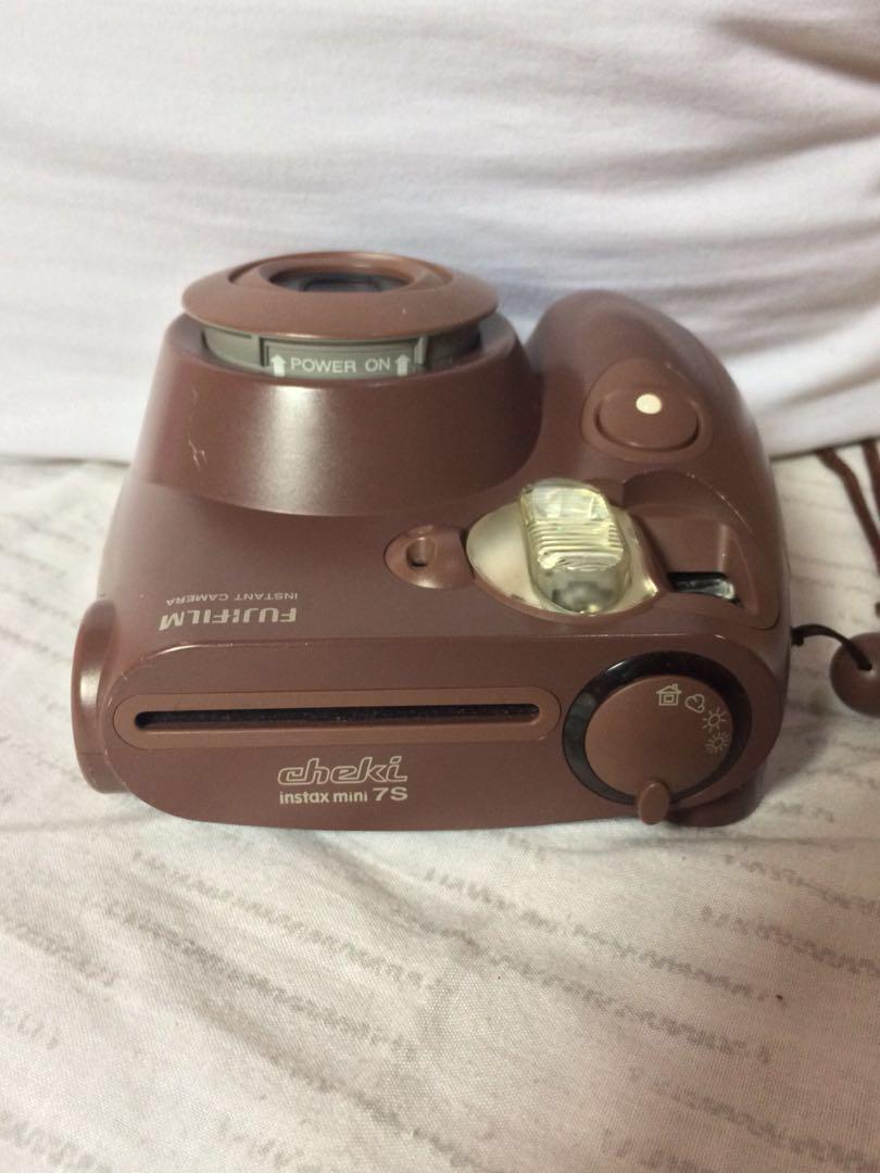 AUTHENTIC Fujifilm Instax Mini Instant Film Camera with Hand Strap (Category: Cameras) located in Manila. Submitted by ces.summers (Listing ID 189054401, Image 2). Description: AUTHENTIC IMPORTED FROM JAPAN Brand: Fujifilm Color: Chocolate Brown Condition: Preloved but Well Loved Features: Auto Focus AA Batteries to operate Easy and quick functions Adjustment dial to customize brightness *Batteries not included #caroufluff #TravelwithCarousell.