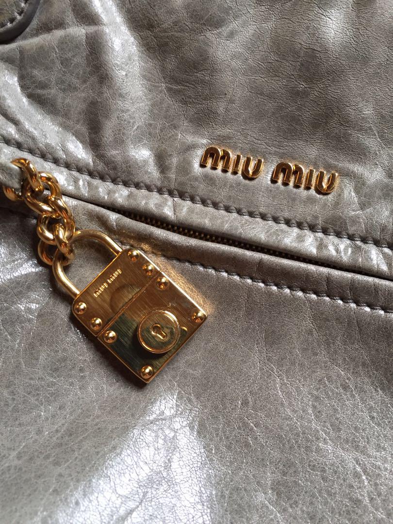 MIU MIU Vitello Bowler Bag (Category: Luxury Bags & Wallets) located in Bulacan. Submitted by relovedbydei (Listing ID 185429345, Image 2). Description: Miu Miu Prada Shiny Vitello Lux Gray Glazed Nappa Leather Bowler Bag Gray leather exterior, satin fabric lining in gold tone hardware. Dual snap closure Leather chain and lock fob Metal logo detail Zippered exterior pocket Detachable shoulder strap .