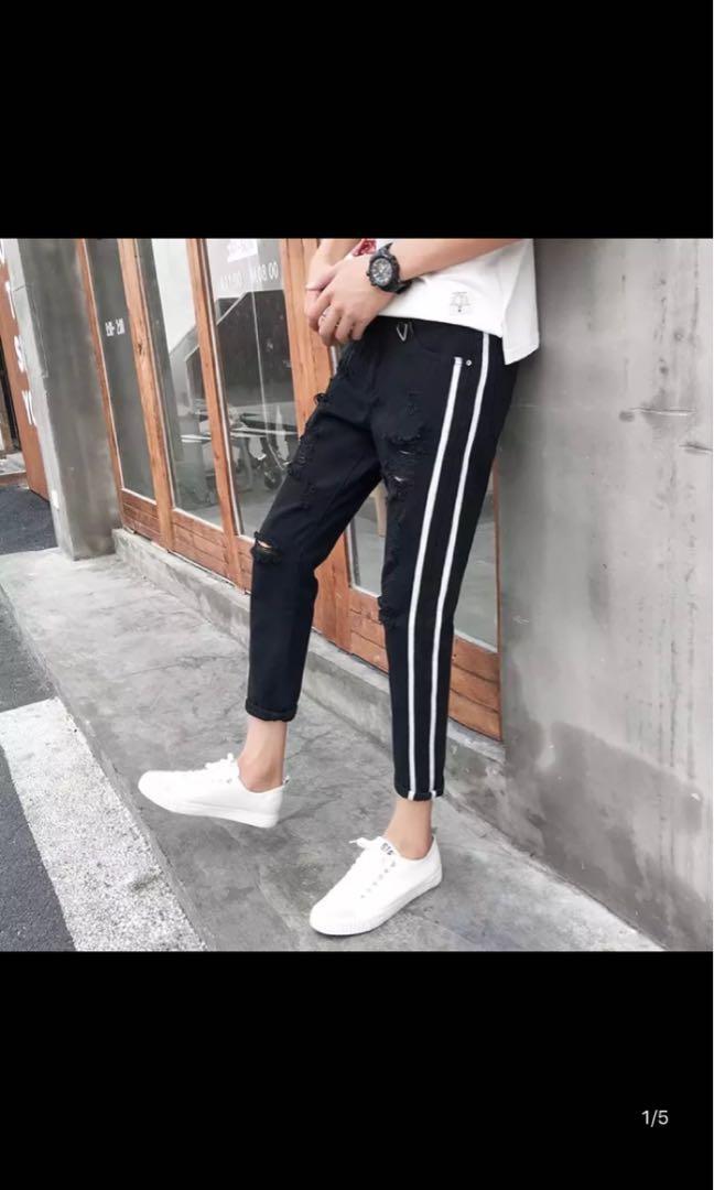 black ripped jeans with white stripe