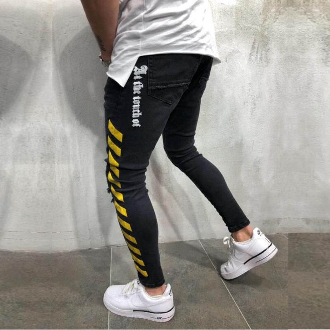 black jeans with yellow stripe