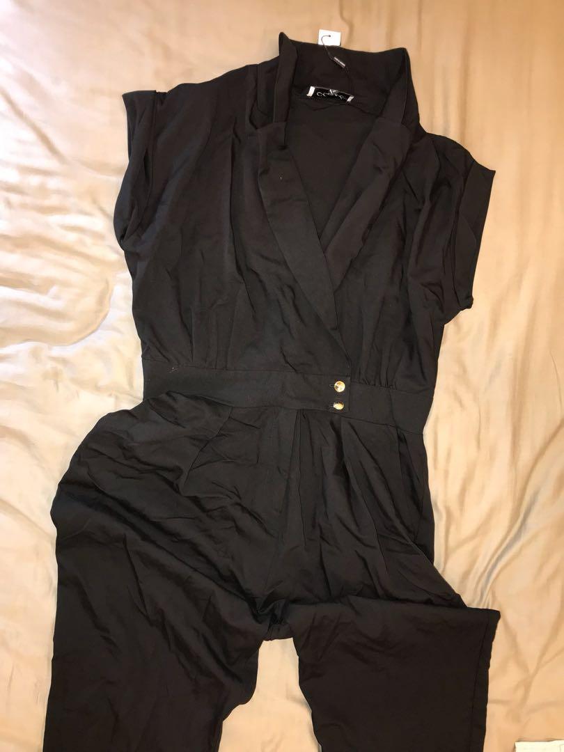 black jumpsuit with gold buttons