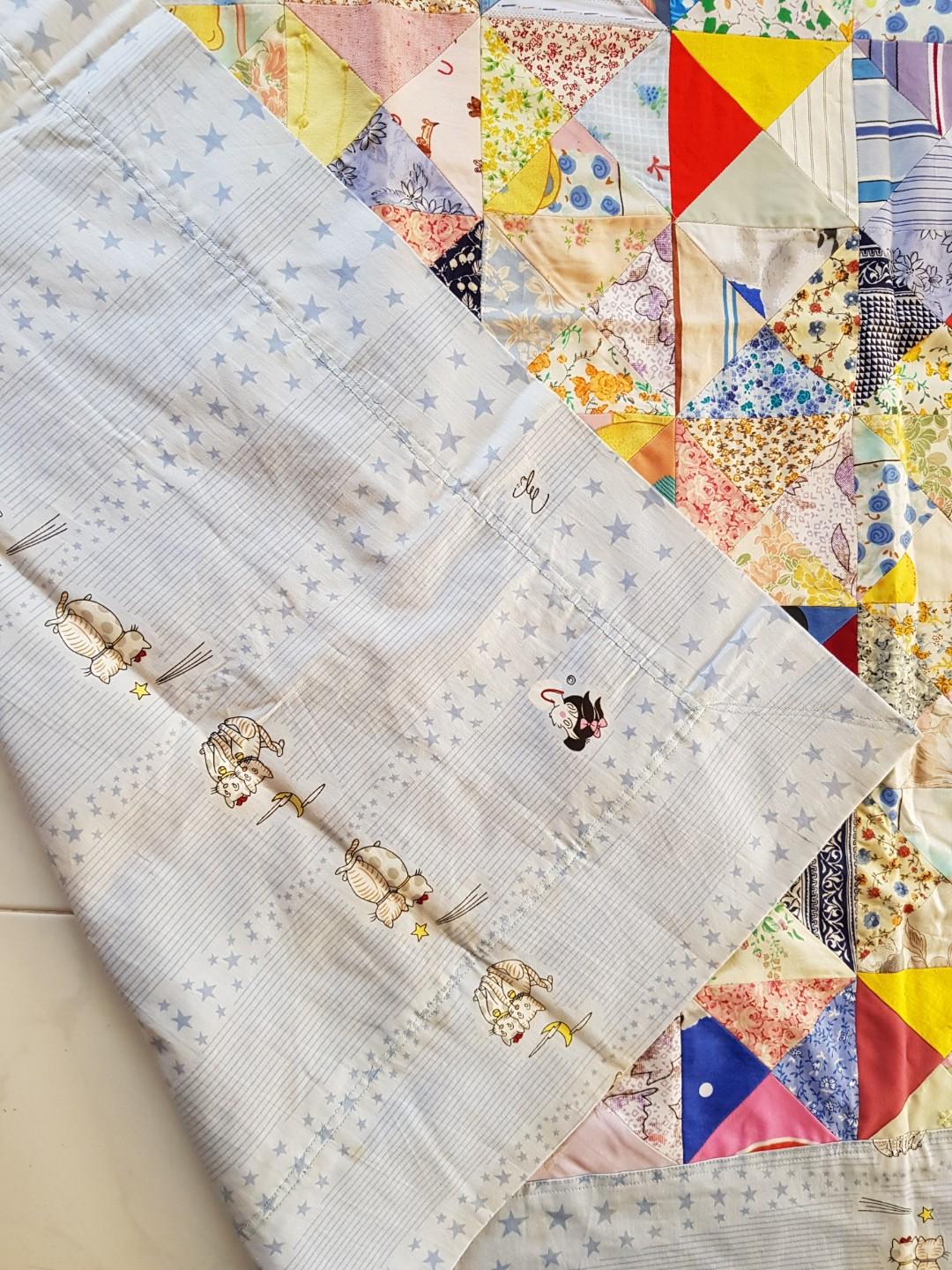 Patchwork Blanket (Category: Changing Mats & Accessories) located in Singapore. Submitted by cokelite (Listing ID 190251404, Image 3). Description: Dimension: 100cm by 95cm. Due to storage, some parts have turned yellow. See photo 5..