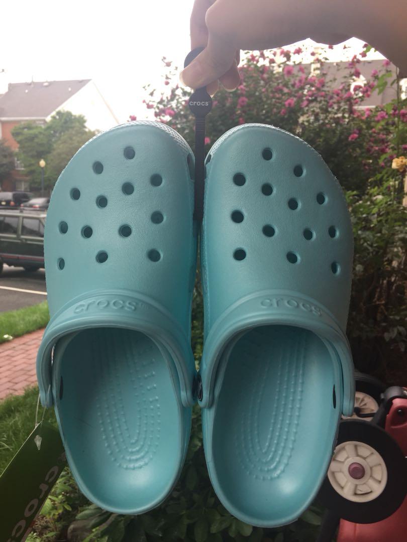 Ice blue crocs, Men's Fashion, Footwear, Slippers & Slides on Carousell