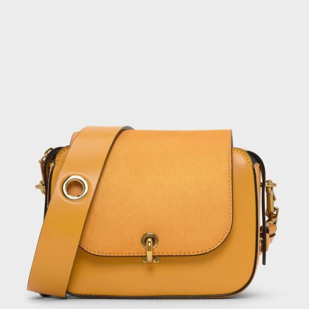 CHARLES KEITH Grommet Strap Bag MUSTARD