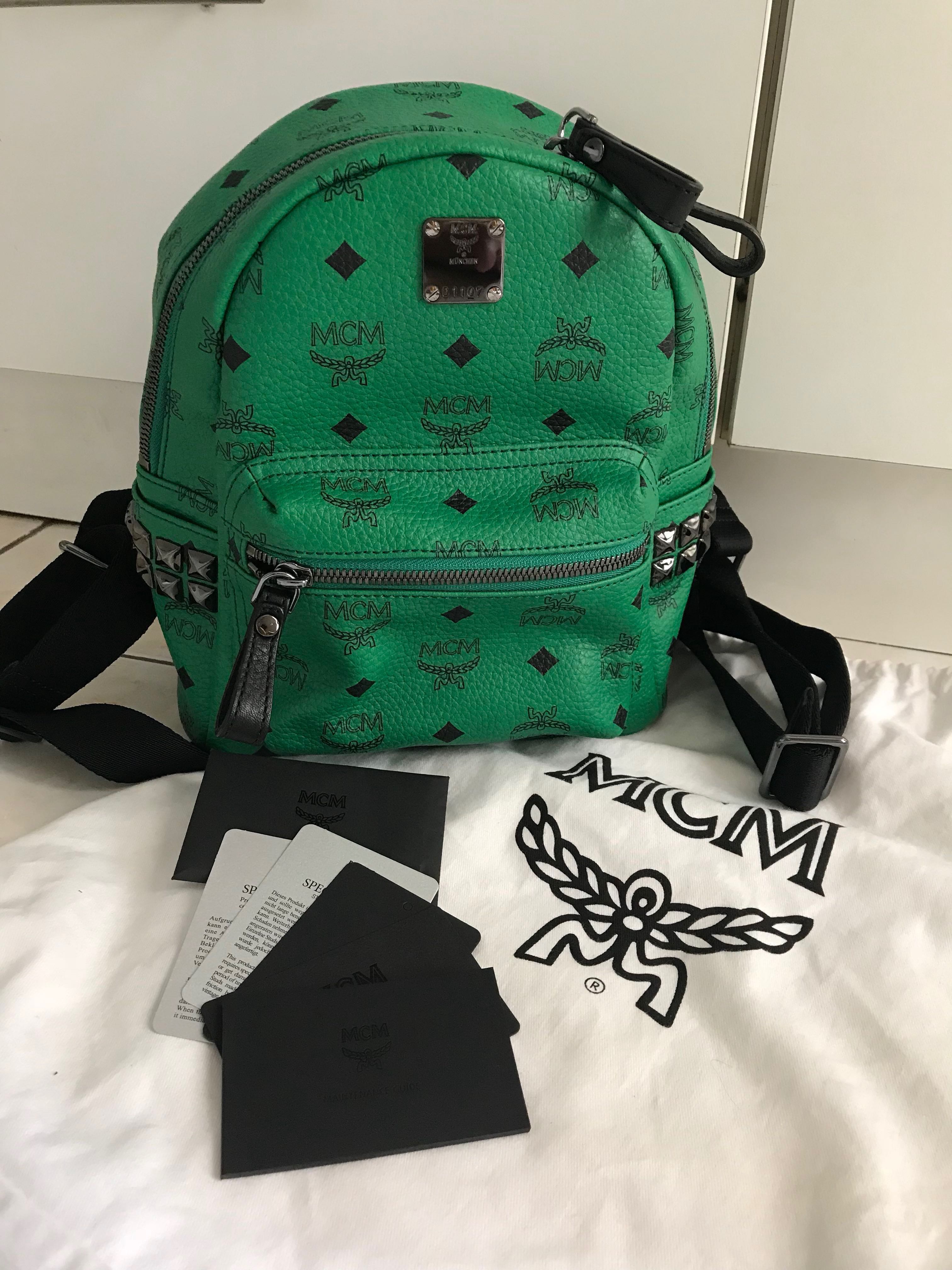 green mcm backpack