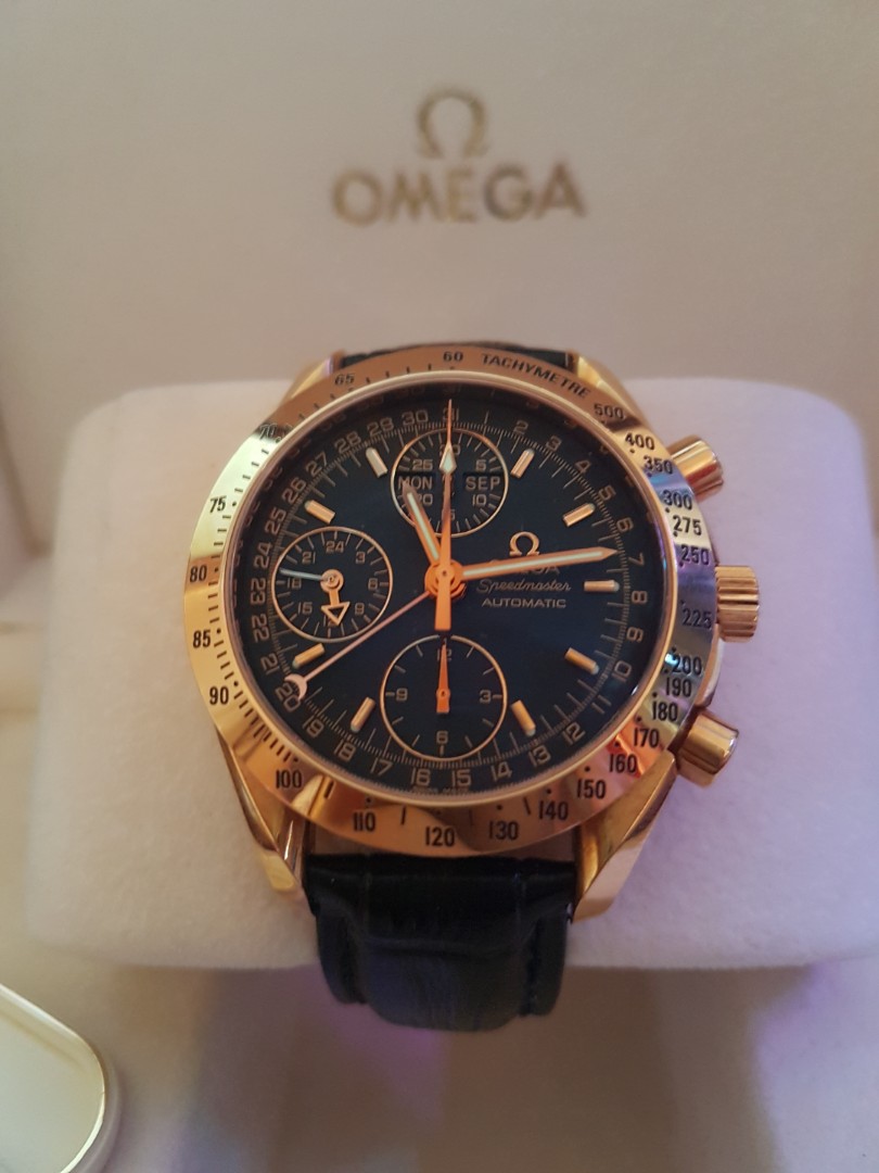 omega speedmaster triple date gold