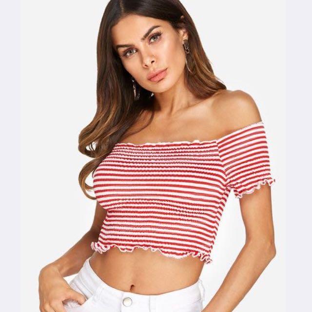 Red and white striped sales off the shoulder to