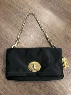 Coach black silk & brass clutch