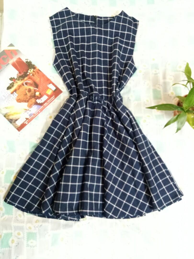 Blue plaid dress (Category: Dresses) located in Marikina City. Submitted by threefty (Listing ID 191912211, Image 2). Description: Navy blue plaid dress Fits Medium to Large Zip back + Garterized waist No Flaws Above knee.