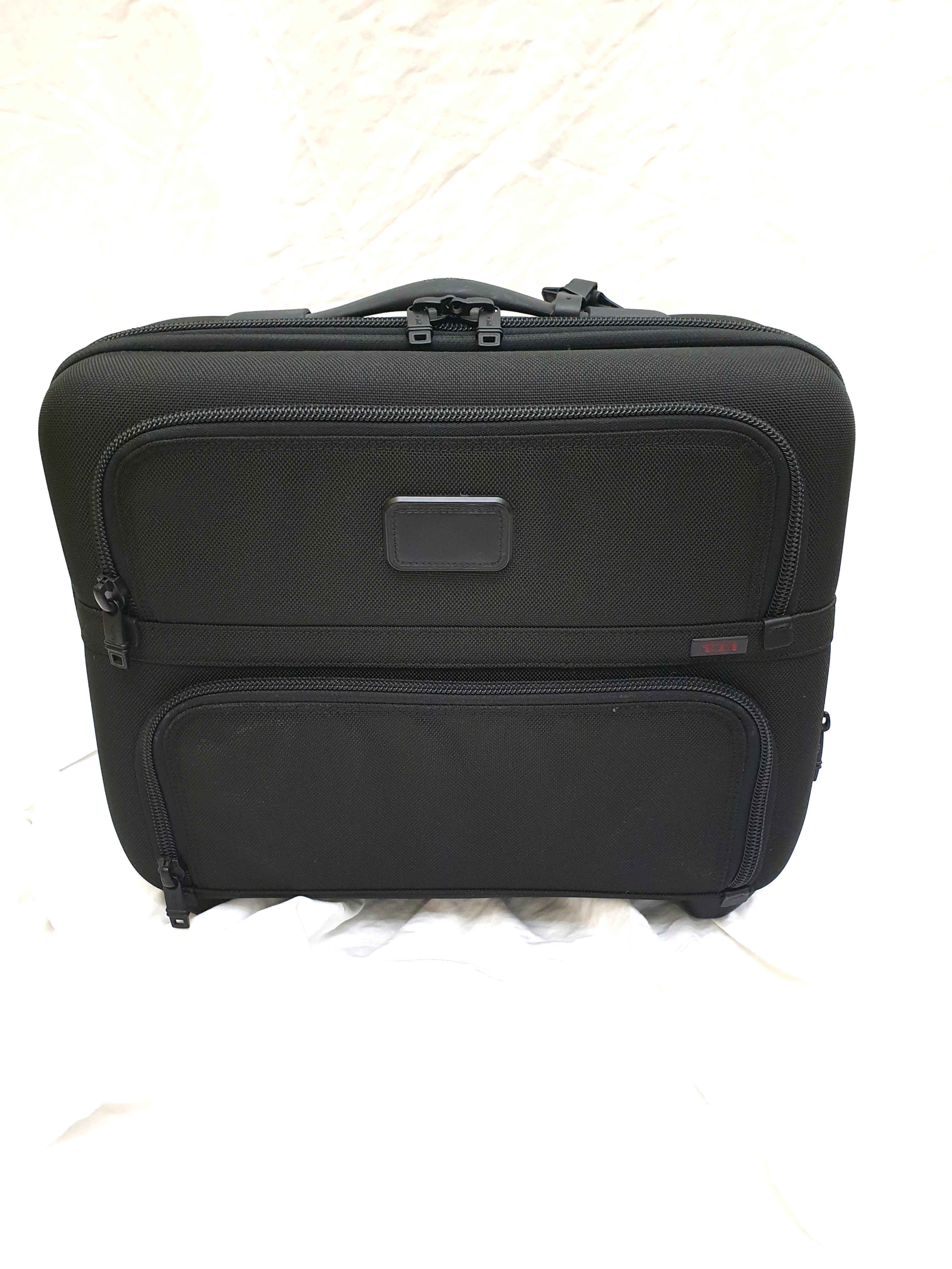 tumi overnight bag with wheels