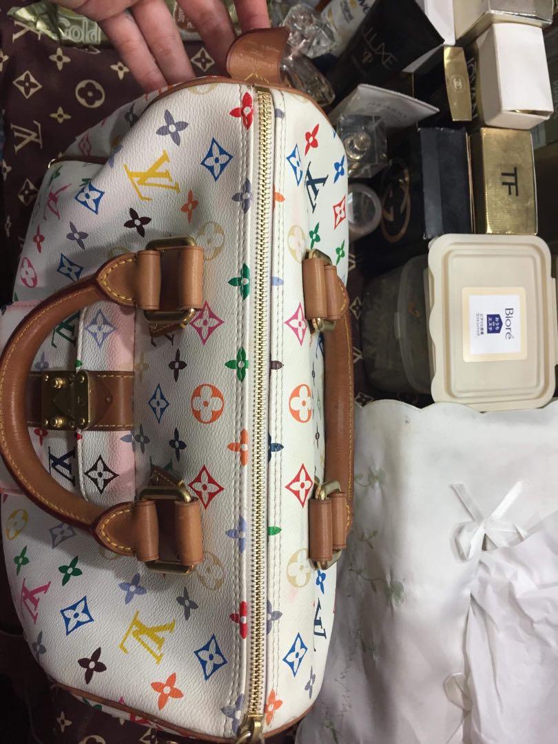 Brooke's Boutique - Classic LV Speedy 35, retails $1620, was $799.99, now  $719.99! normal signs of vintage wear, slight darkening on patina leather.  Missing Leather Tab on Zipper. Please note that the