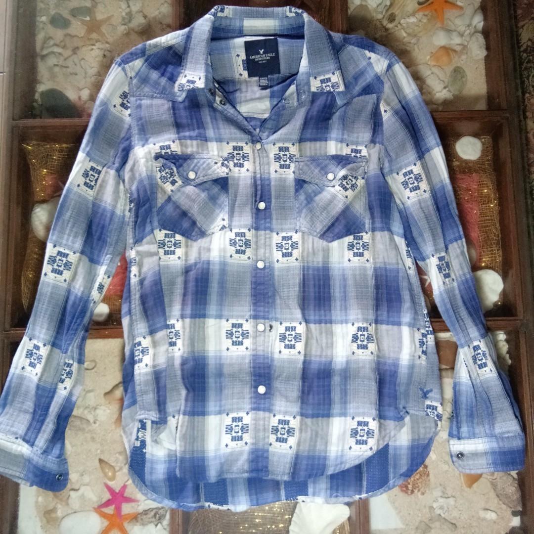 American Eagle Outfitters button down shirt (Category: Others Tops) located in Quezon City. Submitted by rainbowpride (Listing ID 192587933, Image 2). Description: American Eagle Outfitters Blue Plaid Button Down. This button down shirt is in boyfriend fit. Size small but fits medium built. 100% cotton. In good condition. Flaws: small hole at the back of the left sleeve. See last pic for reference.