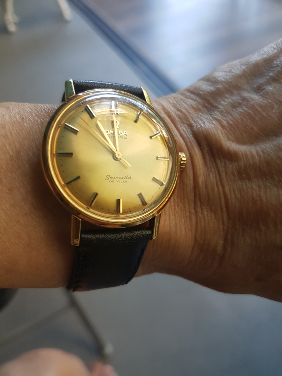 omega solid gold watch