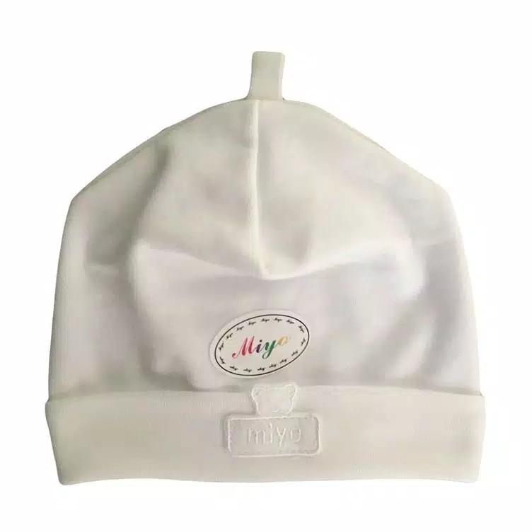 white baby hat and mittens