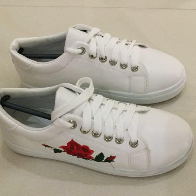 white sneakers with roses