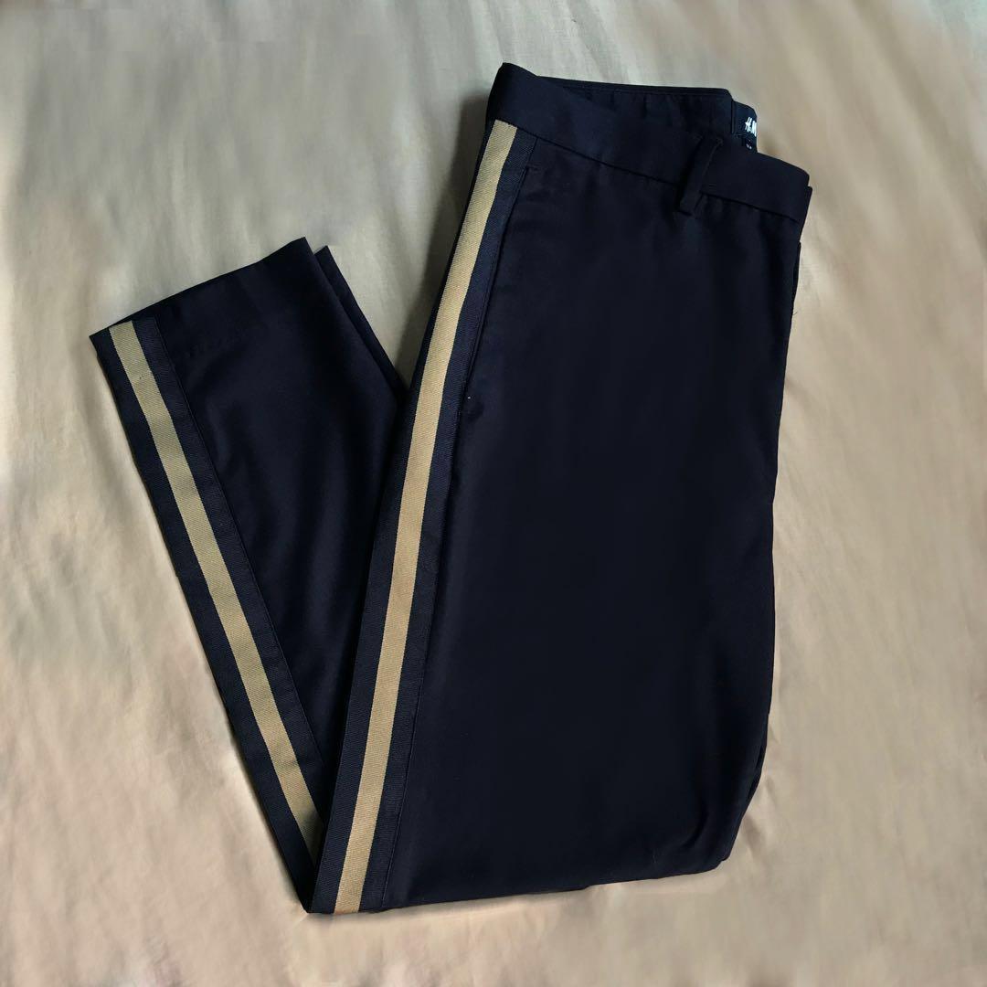 black trousers with gold side stripe