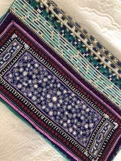 Camilla embellished emerald clutch