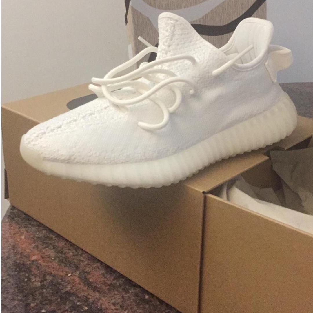 Yeezy supply triple white shipping on sale