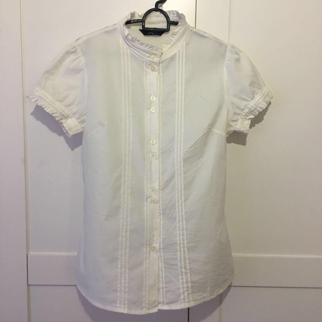 white blouse with ruffle neck