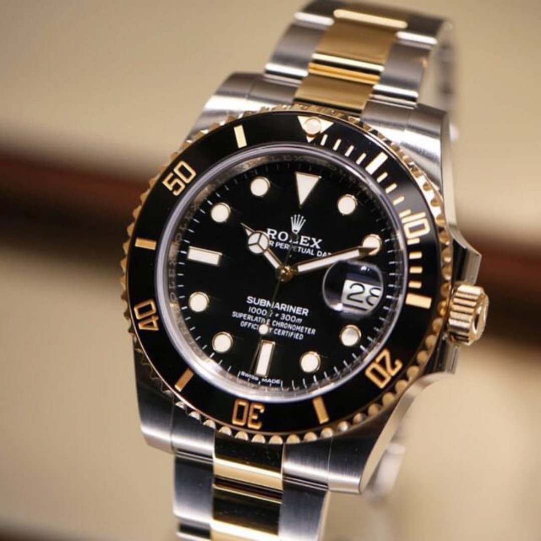 Gold rolex on sale submariner black face