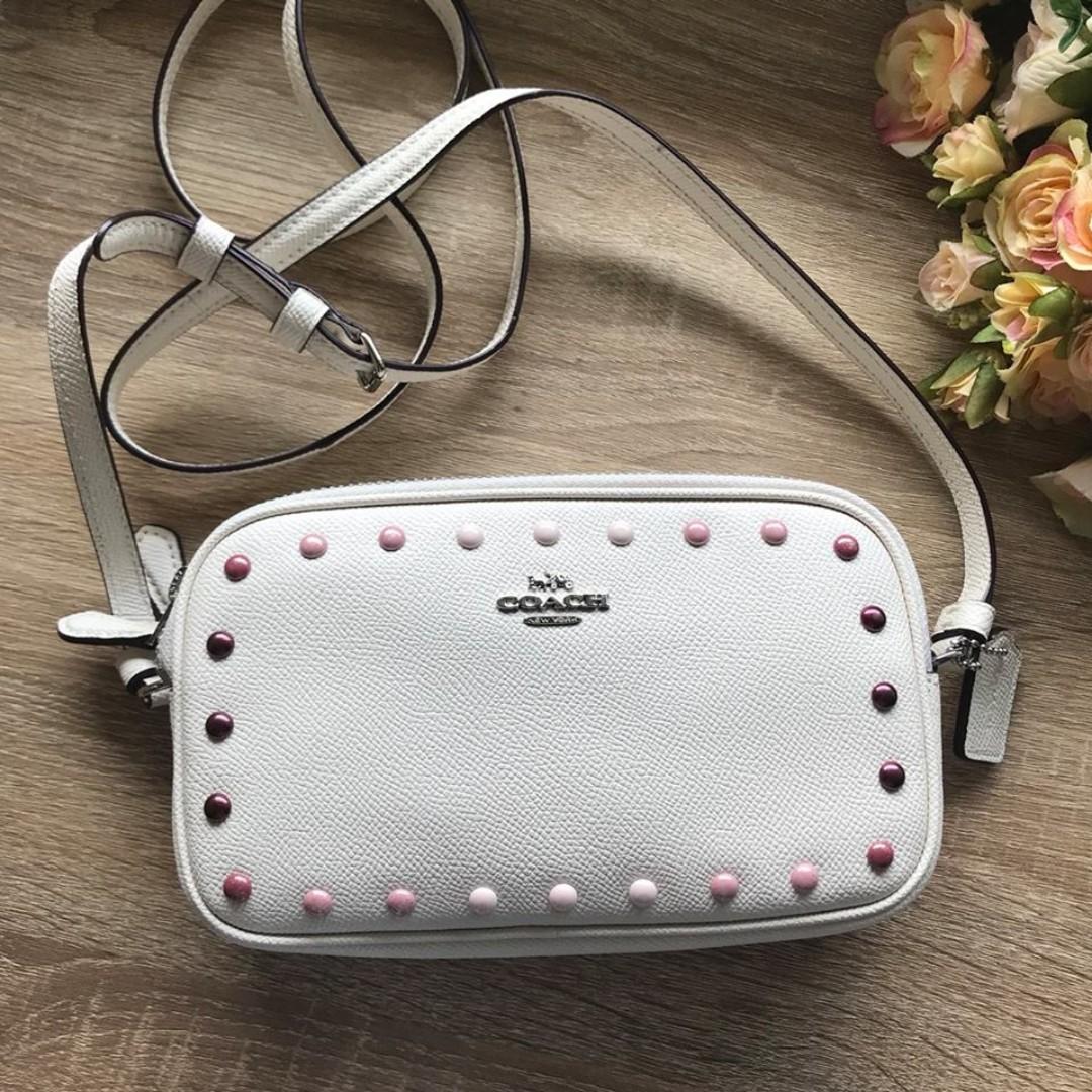 Coach crossbody pouch with rainbow rivets top