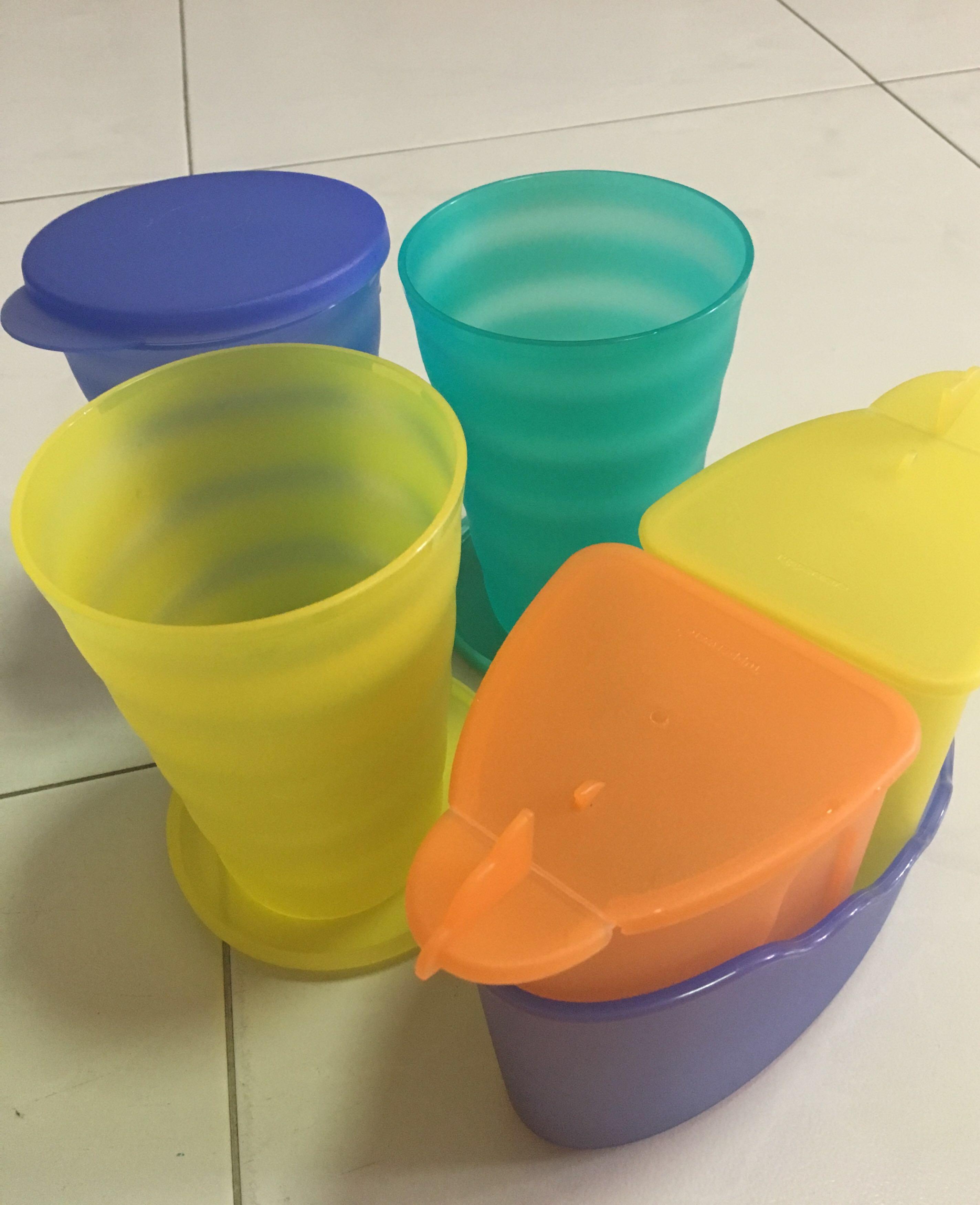 Tupperware (Category: Water Purifers & Dispensers) located in Singapore. Submitted by msslsl (Listing ID 167552049, Image 3). Description: Only the pitcher used for water. The rest are not used. Pitcher height 23cm Mug height 13cm.
