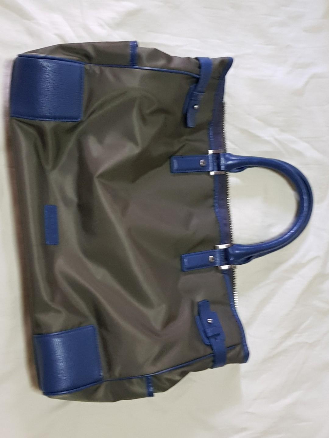 Agnes B Tote Bag (Category: Bags & Wallets) located in Singapore. Submitted by potty_teapot (Listing ID 195928225, Image 1). Description: Agnes B tote bag. Olive green canvas with blue leather trimming. Light-weight bag that is serves well as an everyday bag. Excellent condition..