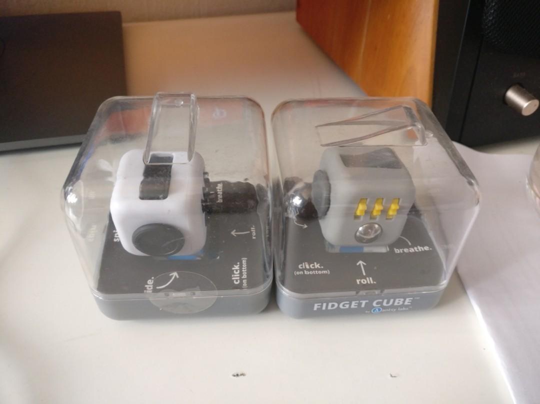 Fidget Cube (Authentic) (Category: Interactive Toys) located in Singapore. Submitted by fr3eze (Listing ID 126228888, Image 1). Description: This is Authentic Fidget Cube from Antsy Labs. The receipt can be shown to prove the Originality. Superior build quality over the pirated version, if you have one, and you should arrange a meet-up to compare it yourselves. To see is to believe! Only 3 different colors are available now as shown in the pictur