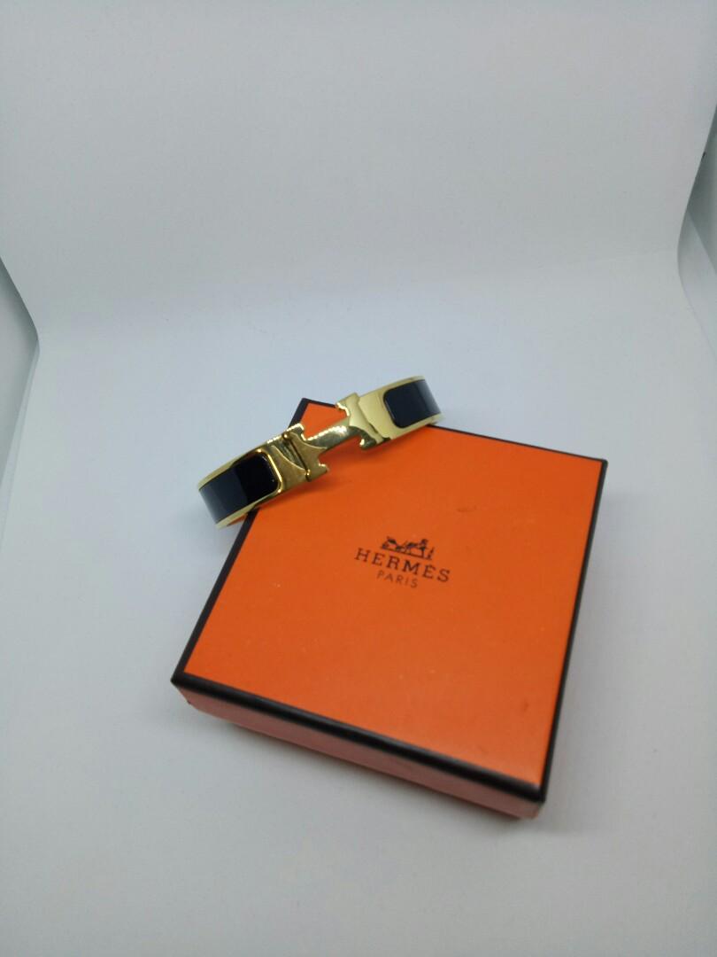 Hermes Black - Gold H Bracelet (Category: Bracelets) located in Antipolo. Submitted by unclogged (Listing ID 195768788, Image 3). Description: Hermes black - gold Bracelet Unused RFS: a gift but I already have the same exact bracelet Note: it comes with a box Actual pictures on 3-5.
