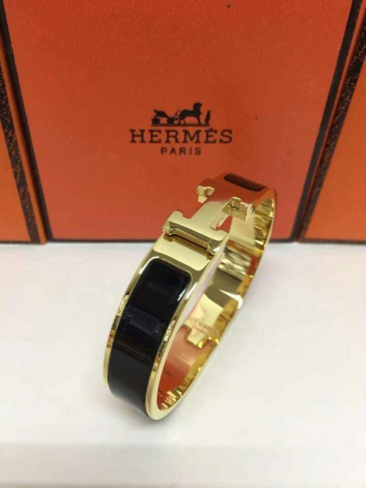 Hermes Black - Gold H Bracelet (Category: Bracelets) located in Antipolo. Submitted by unclogged (Listing ID 195768788, Image 2). Description: Hermes black - gold Bracelet Unused RFS: a gift but I already have the same exact bracelet Note: it comes with a box Actual pictures on 3-5.