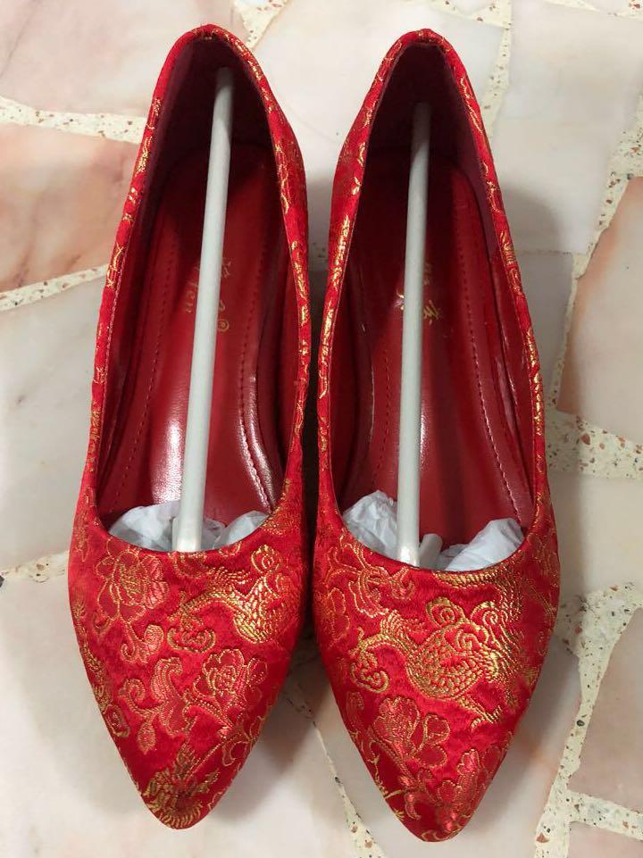 red embroidered heels