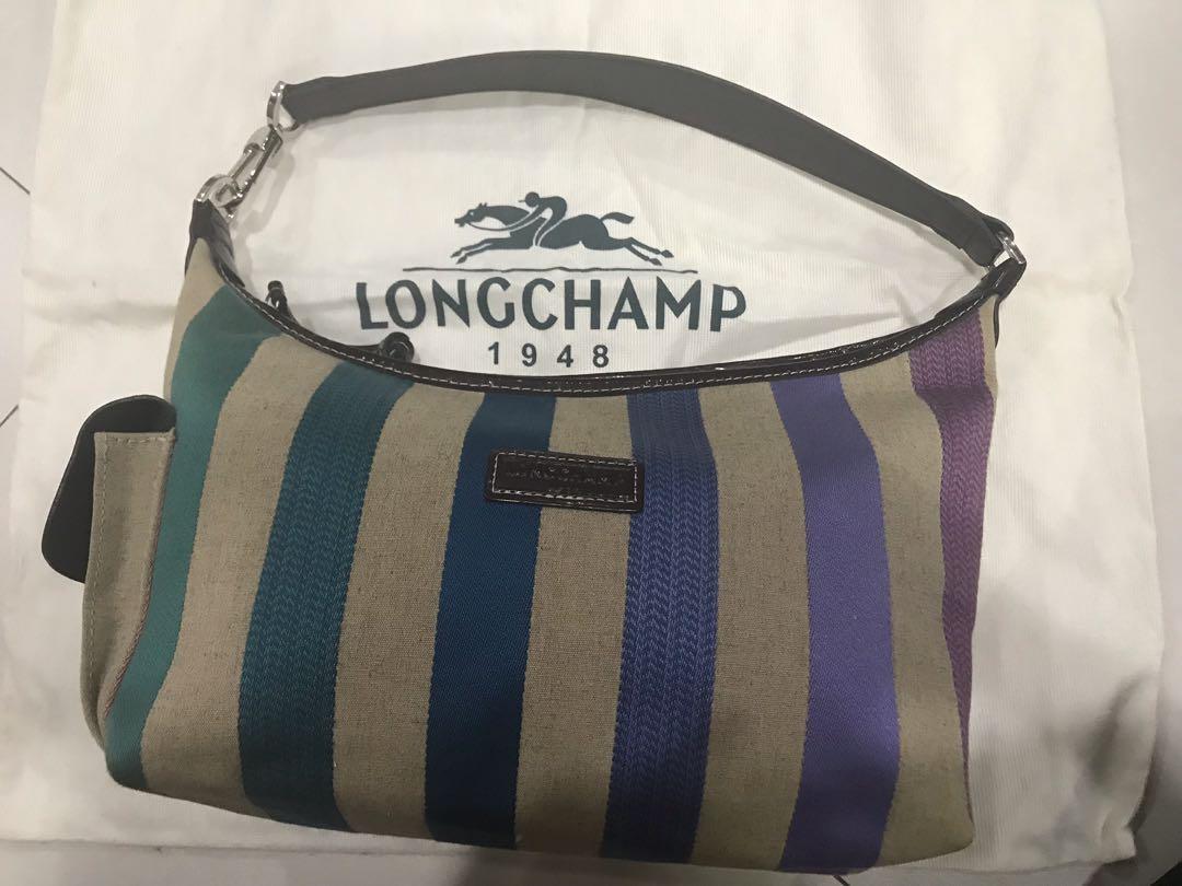 Authentic Preloved Longchamp multicolored Canvas Shoulder Bag (Category: Luxury Bags & Wallets) located in Manila. Submitted by chinchinshaven (Listing ID 196500894, Image 1). Description: Authentic Longchamp Multicolored Canvas Shoulder Bag Comes with Dust Bag Used 5-6x RFS: decluttering Price is negotiable.